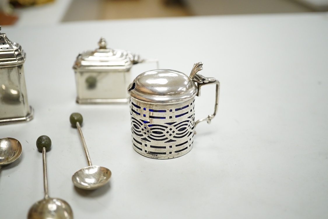 A George V silver three piece condiment set by Mappin & Webb, Birmingham, 1927(two lacking liners), together with one other silver mustard pot, four silver bean end coffee spoons and a white metal propelling pencil.